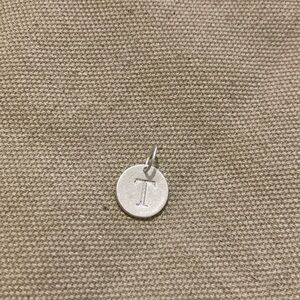 Sterling silver charm with initial ‘T’